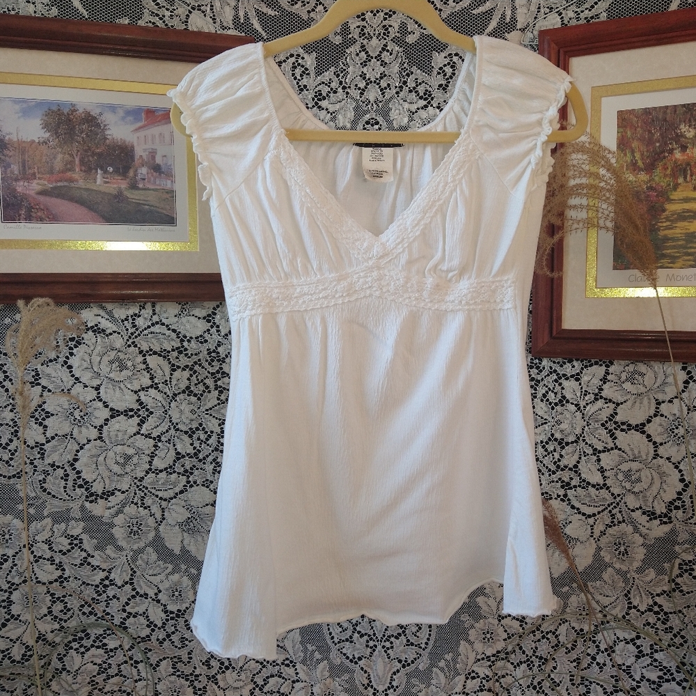 Ferocious Chik white tunic blouse sleeveless lace v neckline ruffle sleeves